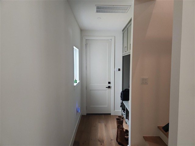 Interior garage-to-house door — self-closer doesn’t fully shut it