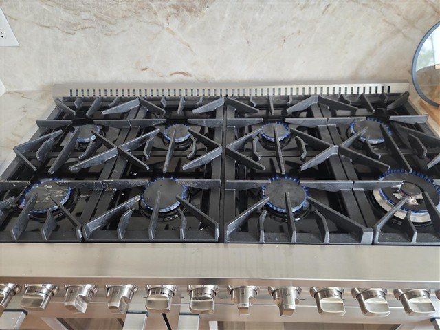 Range / cooktop — very low burner flame on the highest setting