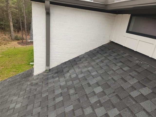 Flashing not visible at roof-to-brick wall transitions