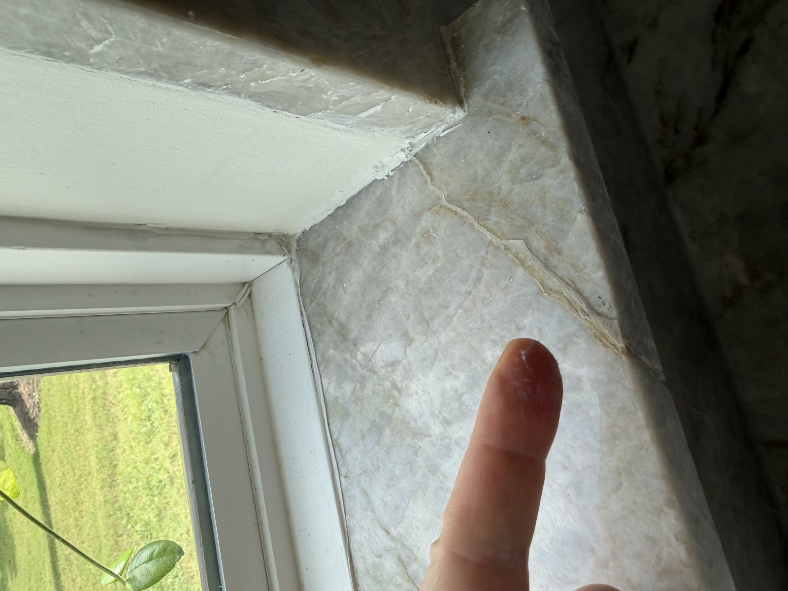 Cracked stone at a window jamb